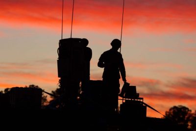 Members of the United States Army working at dawn